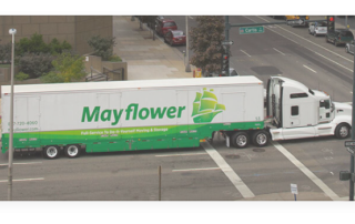 Mayflower Moving truck driving in downtown orlando