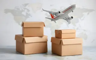 Mini cardboard boxes with a plane flies above world map. For several purposes or ideas about transportation, international freight, global shipping, overseas trade, regional / local forwarding, flat
