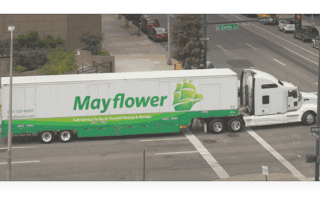 Mayflower Moving truck driving in downtown orlando