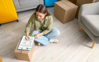 woman filling out sorensen moving out cleaning checklist