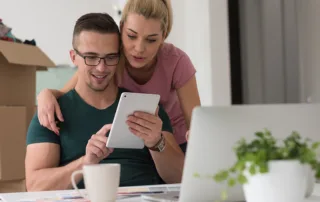 young couple moving looking at move financing options